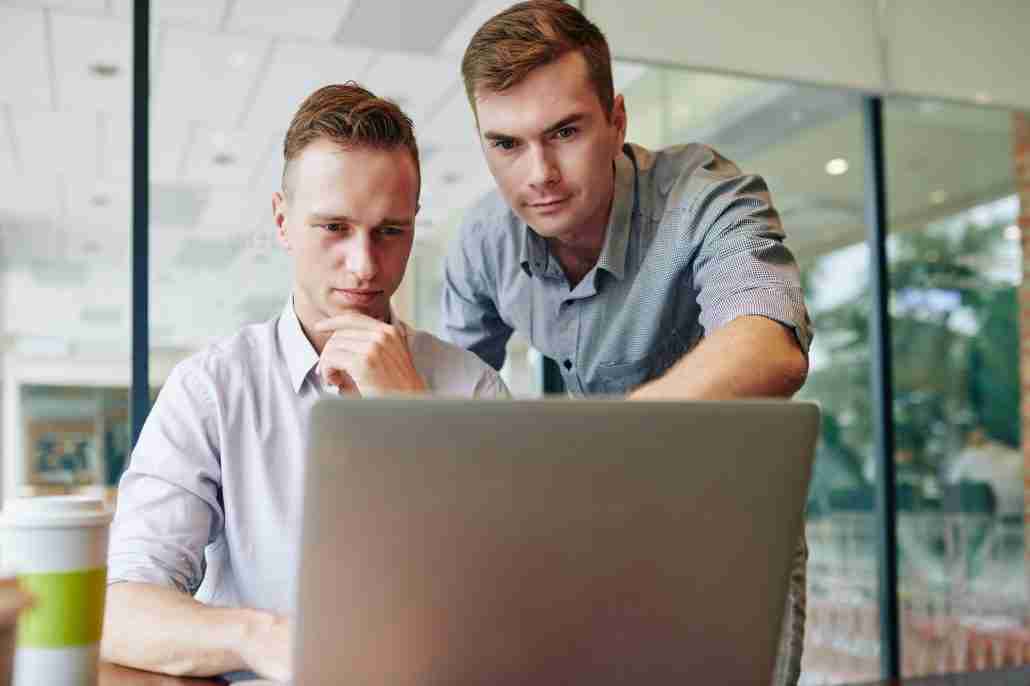 Entrepreneur helping colleague